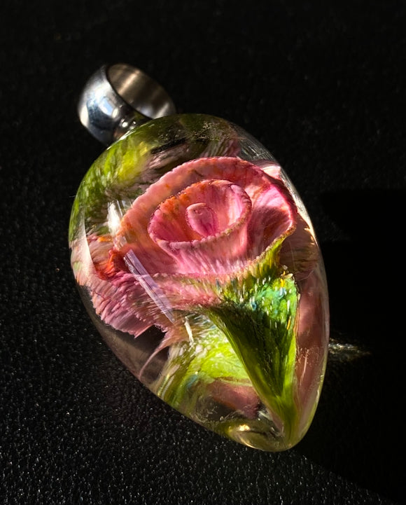 pink flower glass bead with green leaves